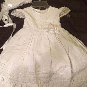 White lil girl’s dress and bonnet
